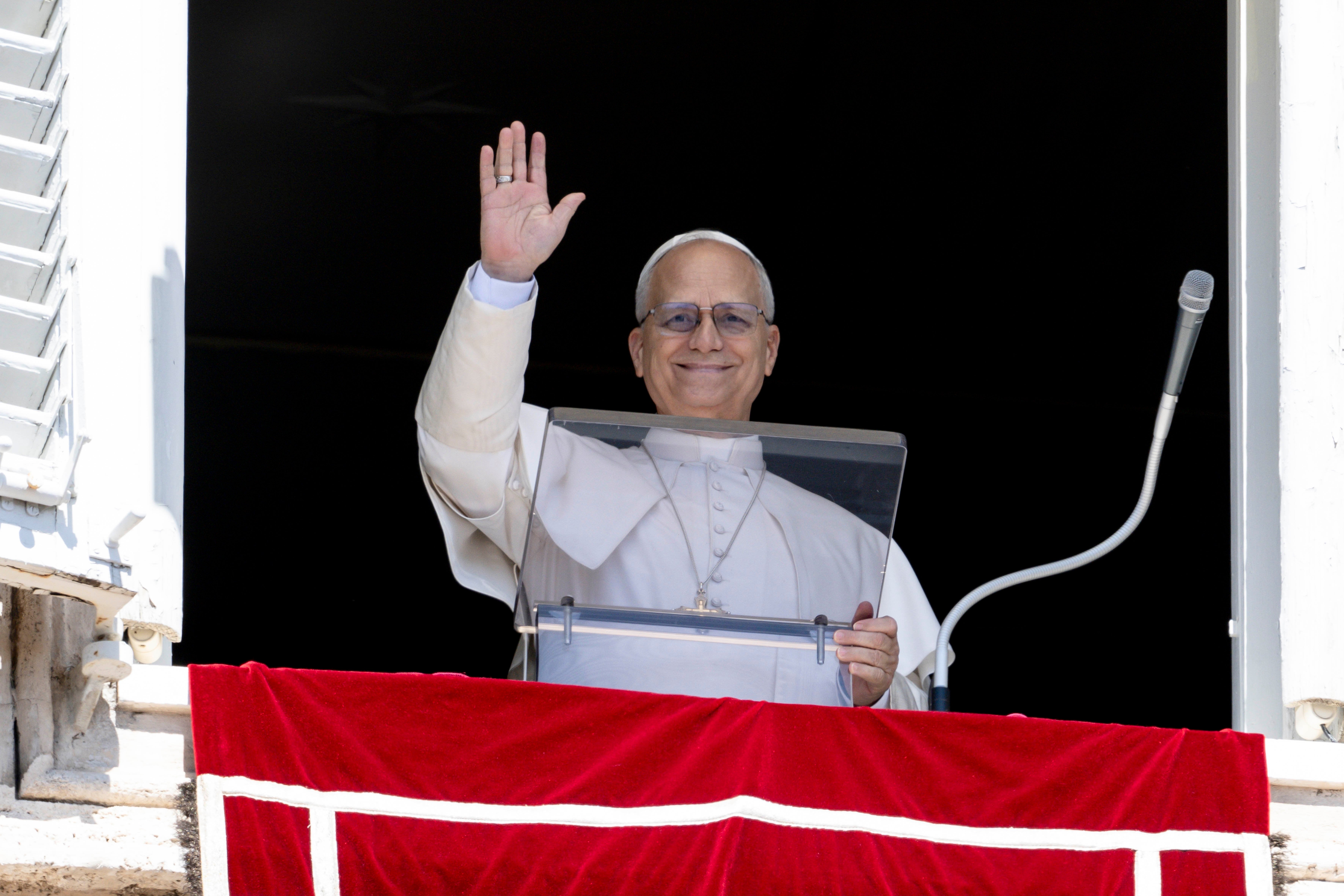 Pope Leo XIV waves to a crowd in St. Peter's Square
