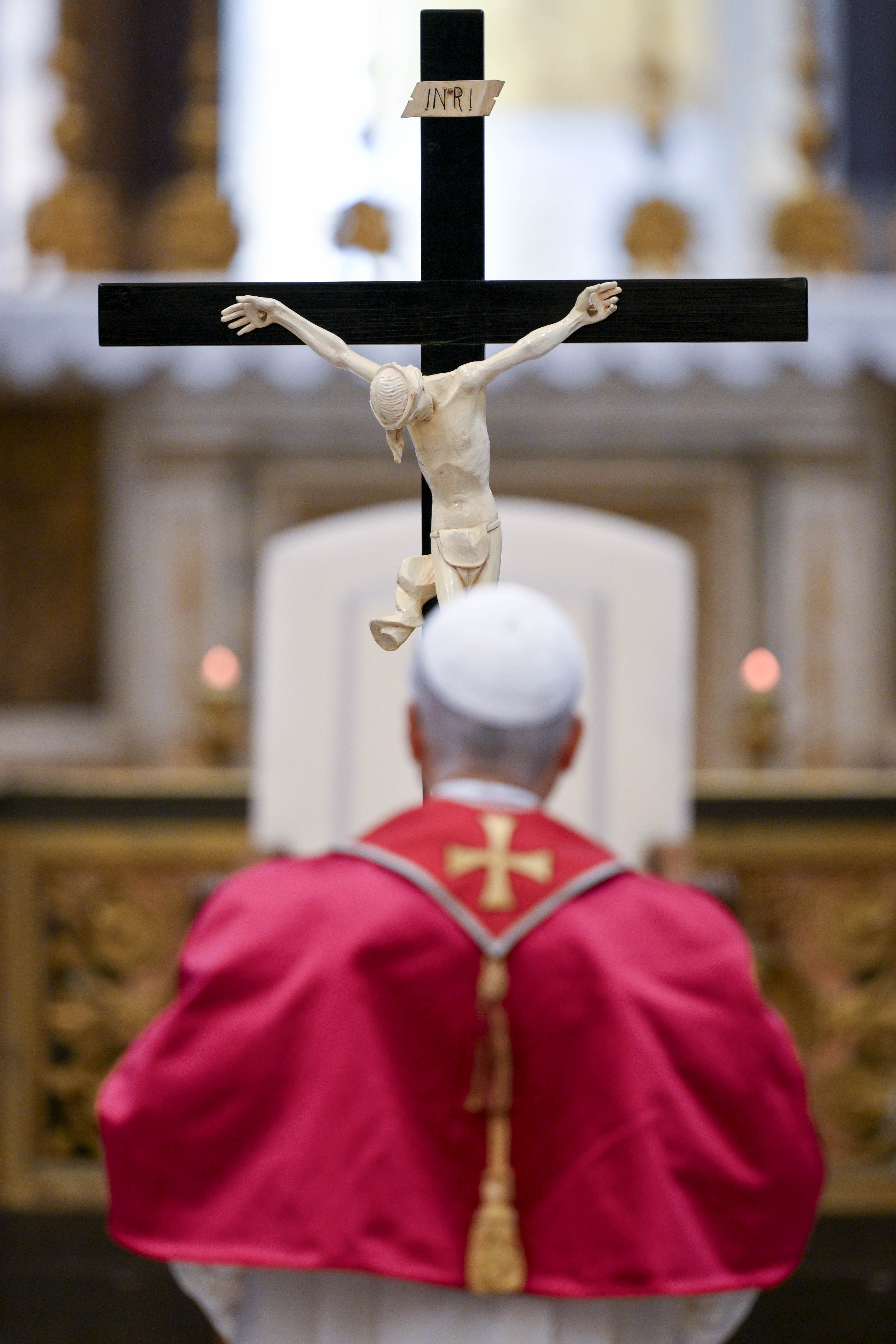 Pope Leo XIV venerates the cross