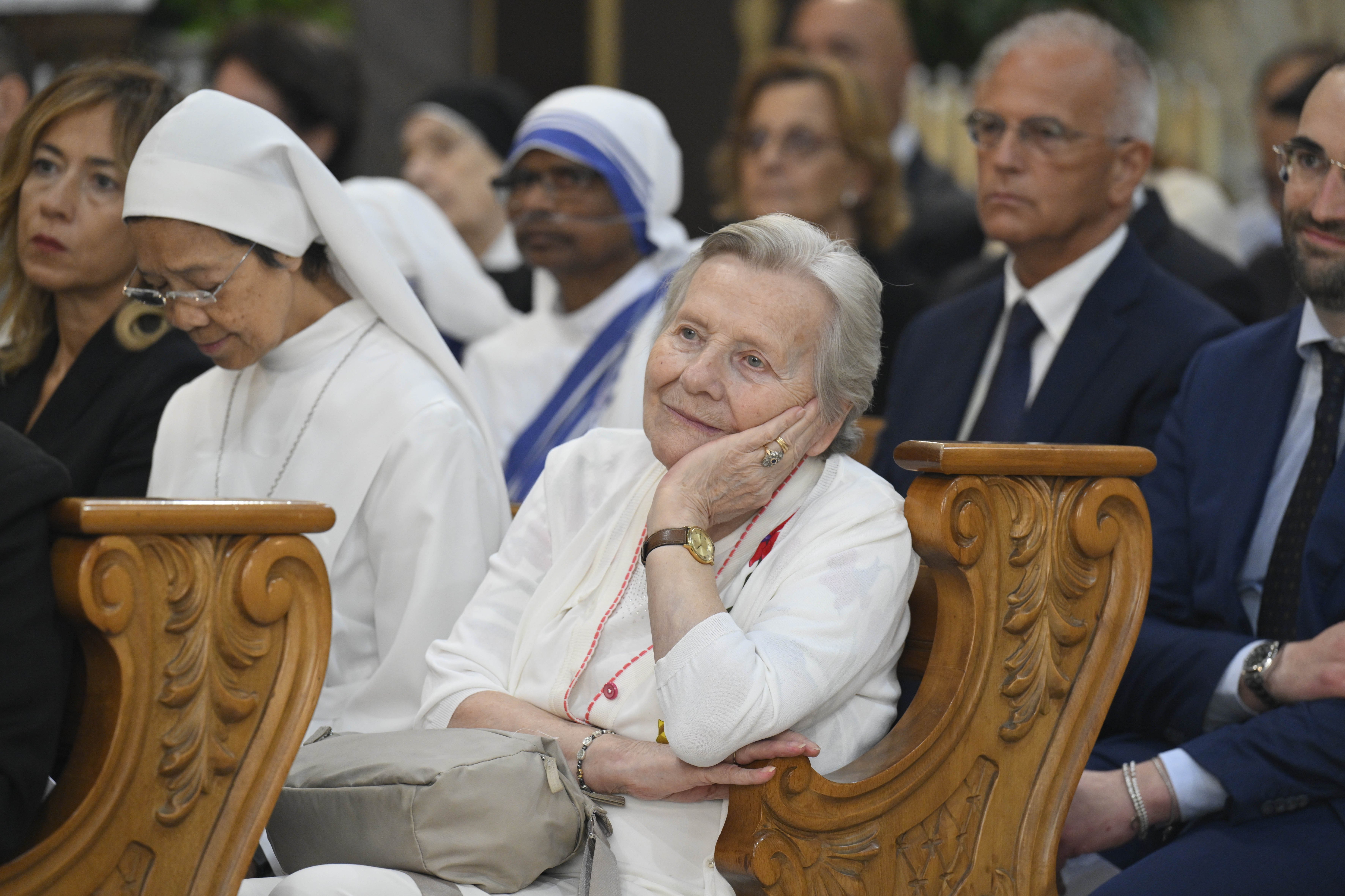 A woman attends Mass with Pope Leo in the Church of St. Anne