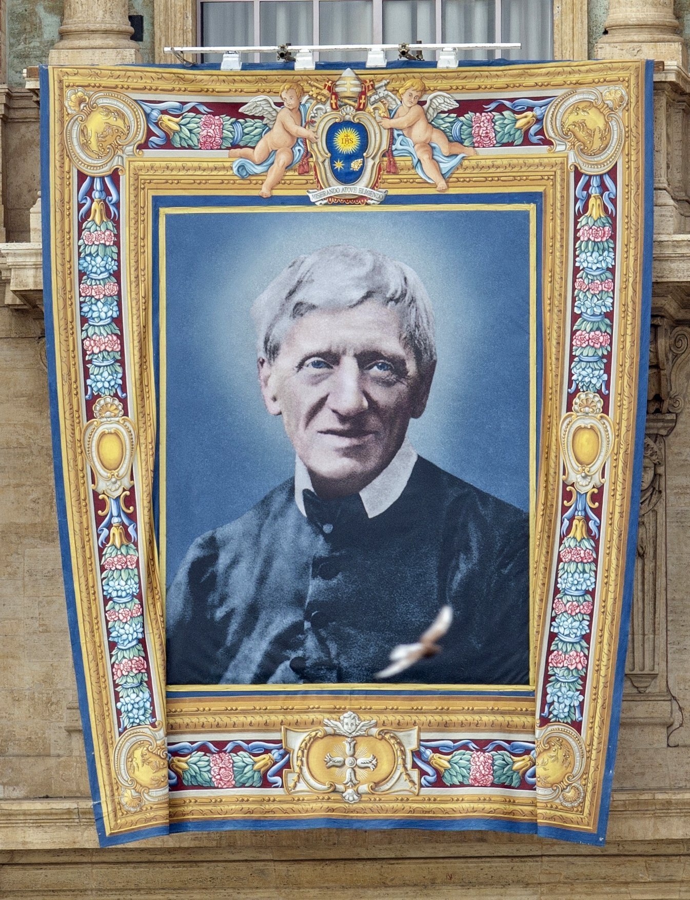 A banner featuring an image of St. John Henry Newman