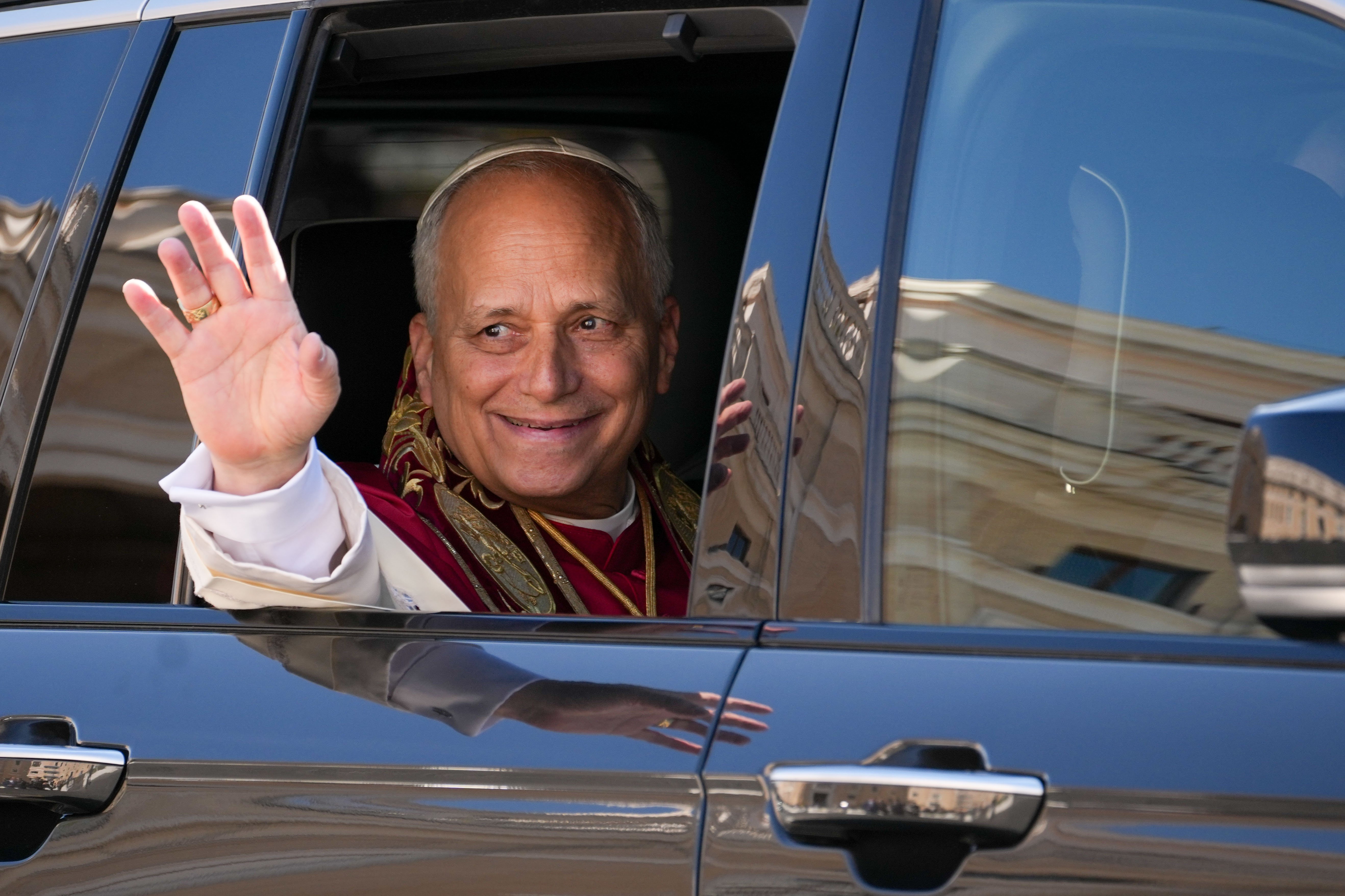 Pope Leo waves from his car
