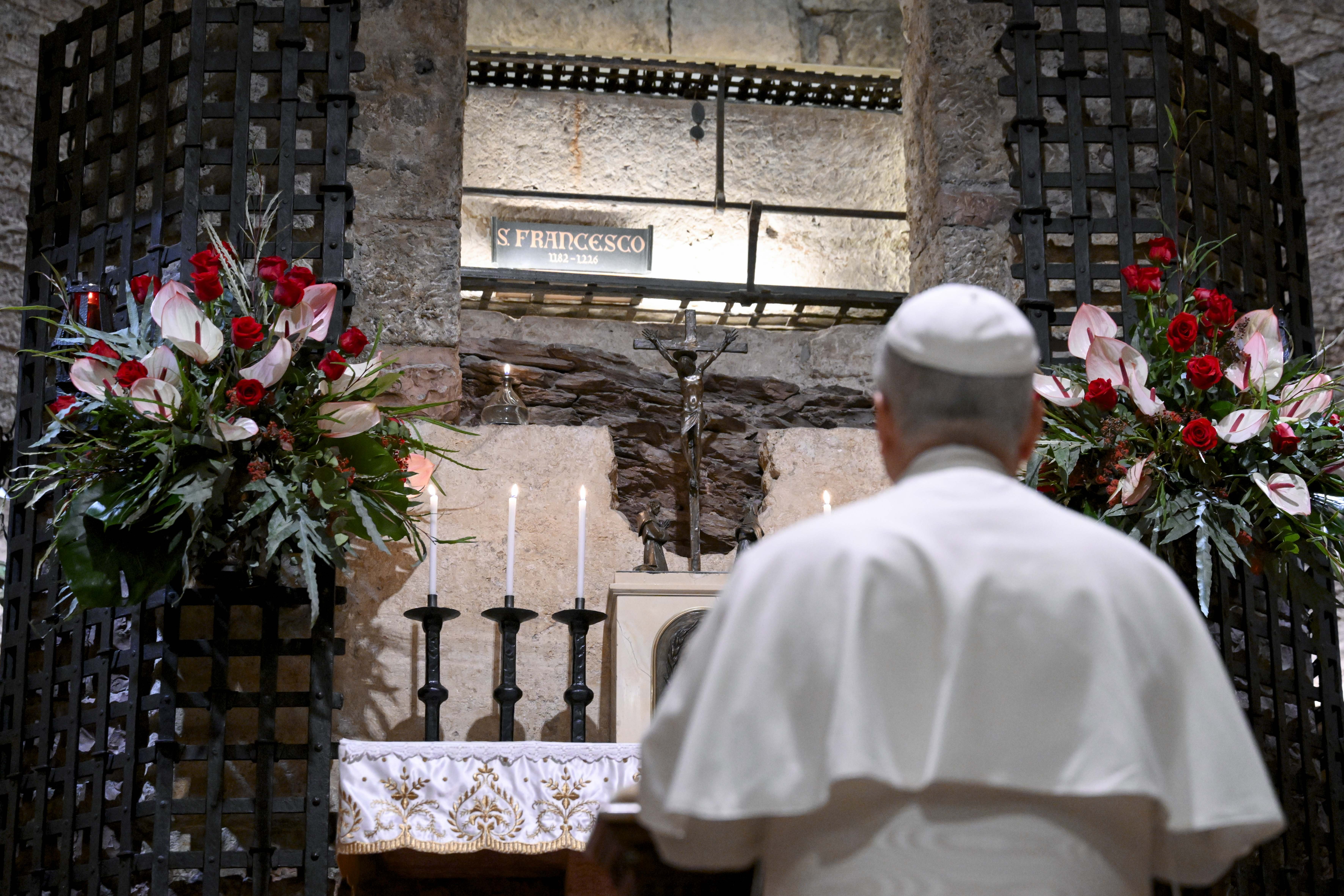Pope Leo prays at the tomb of St. Francis of Assisi