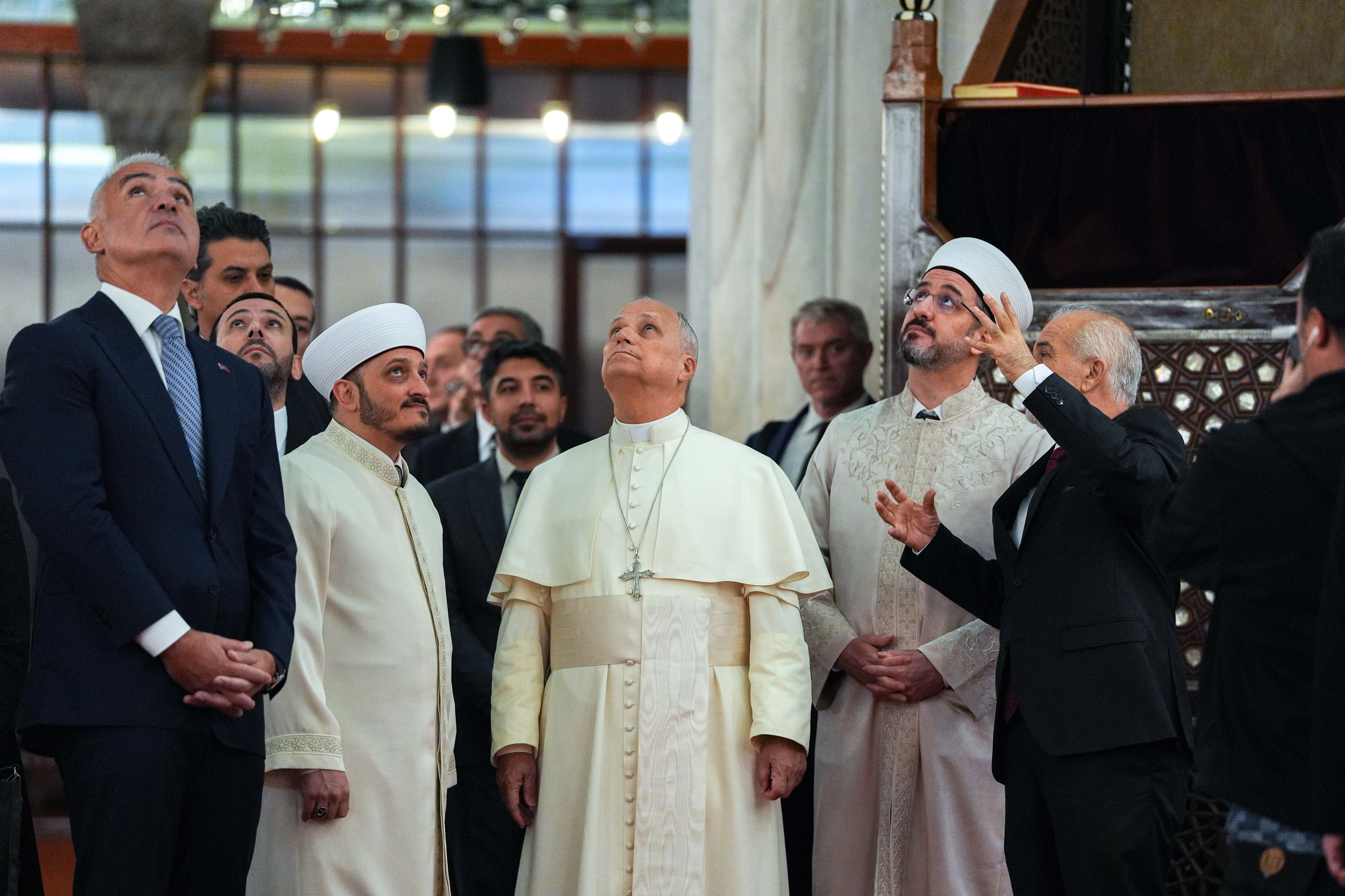 Pope Leo looks at the ceiling of the Blue Mosque
