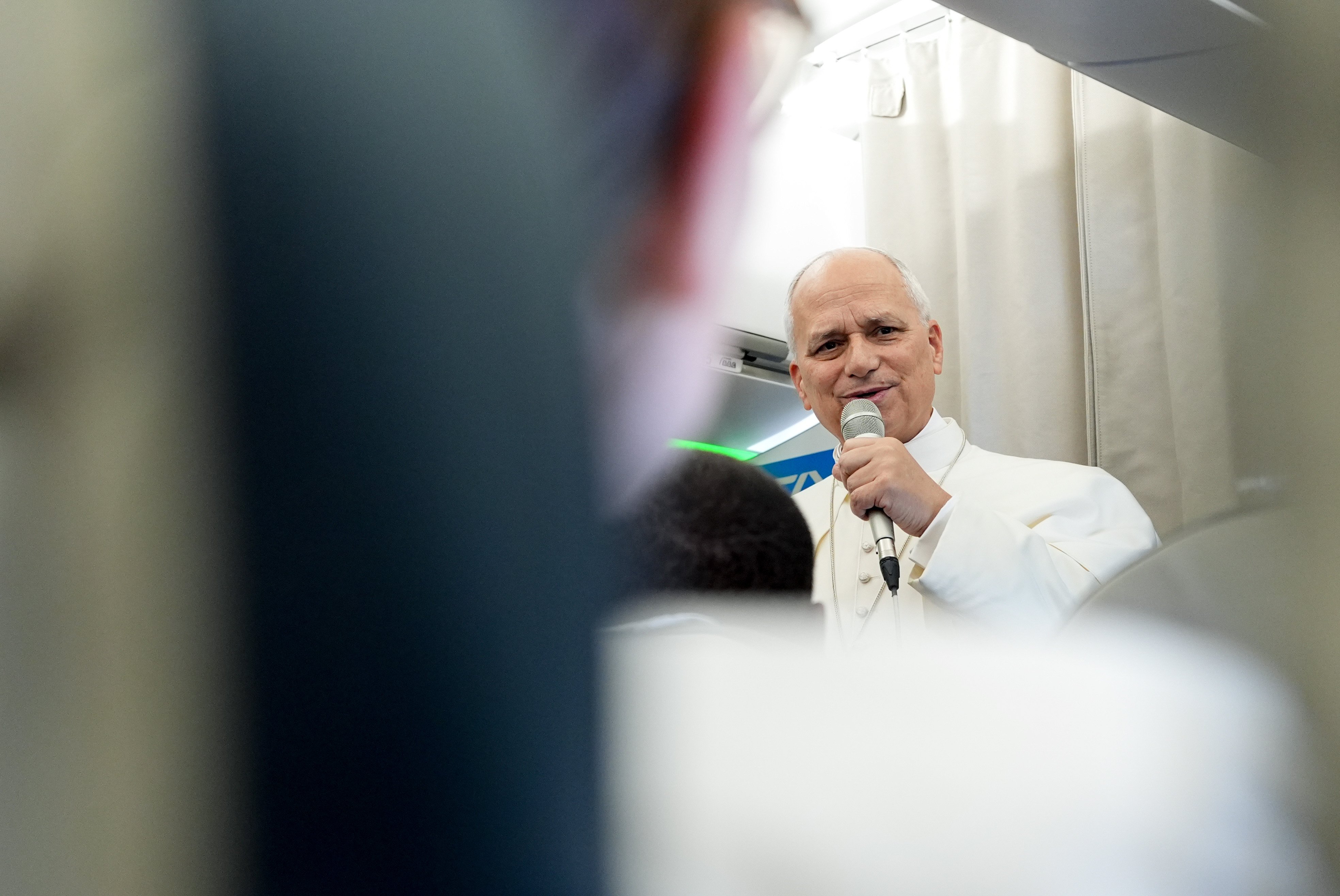 Pope Leo with reporters on the papal plane