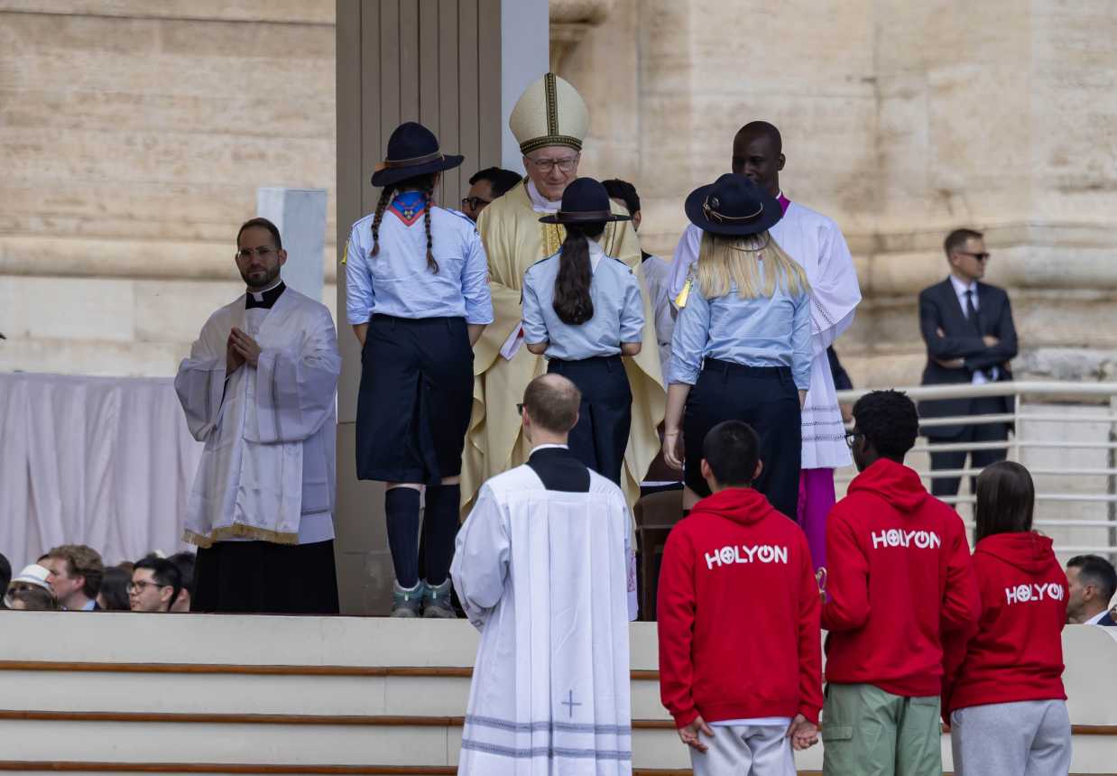 Young people bring offertory gifts to the altar