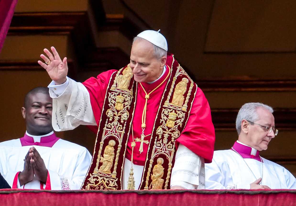 Pope Leo waves to people in St. Peter's Square