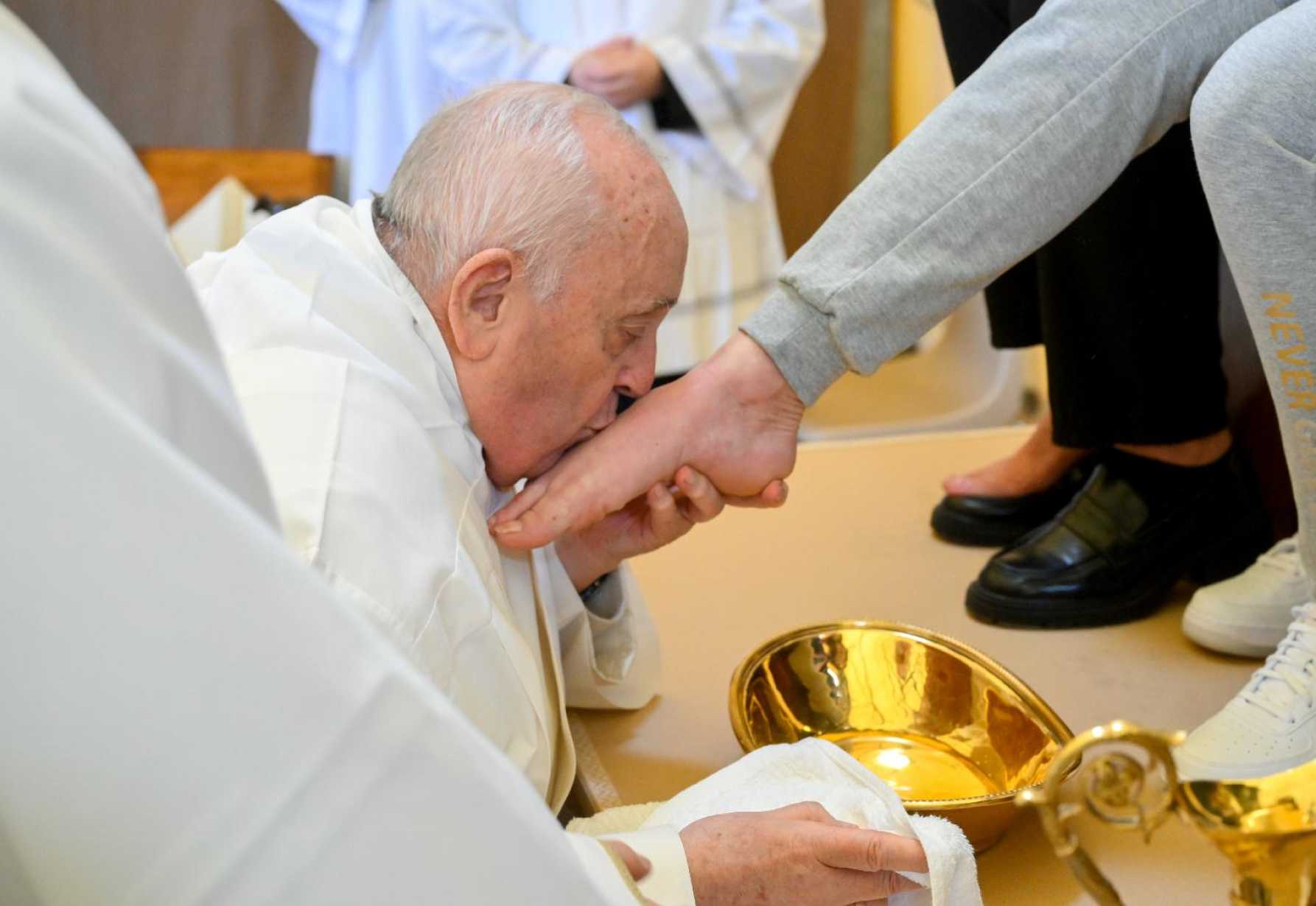 Tears flow as pope washes feet of women inmates at Rome prison