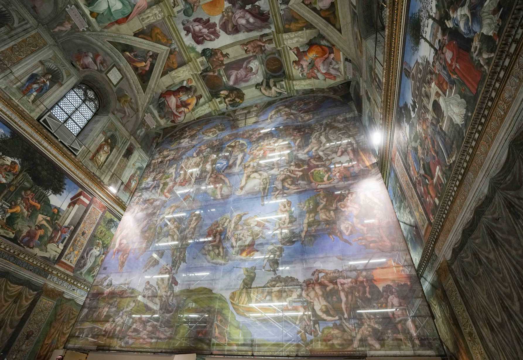 Visitor breath, sweat and climate change prompt work on Sistine Chapel masterpiece