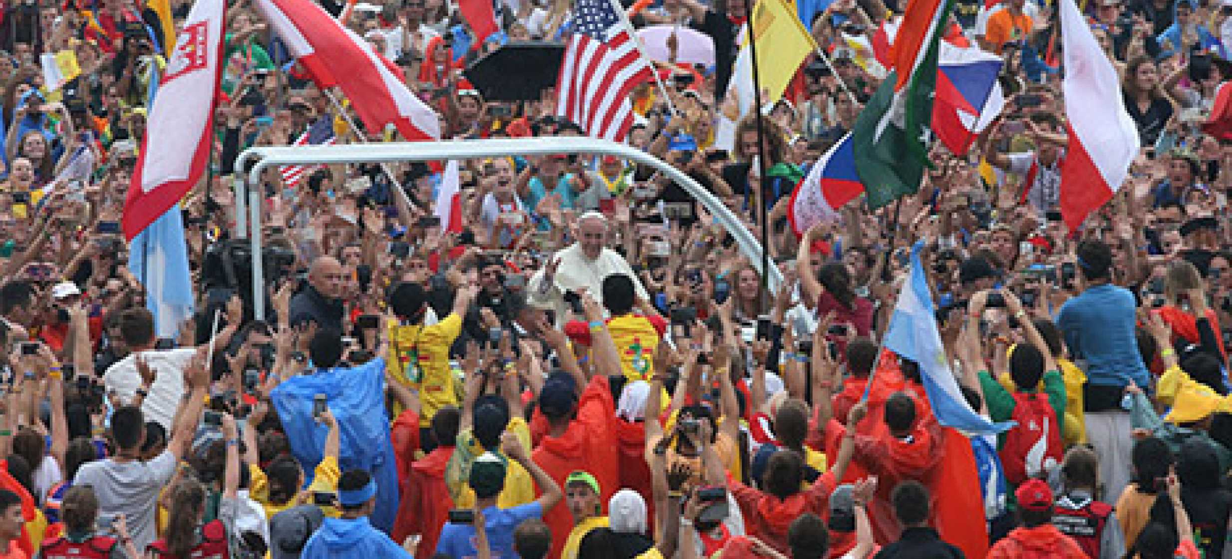 Pope Francis greets the crowd as he arrives to attend the World Youth Day welcoming ceremony July 28 at Blonia Park in Krakow, Poland. (CNS photo/Bob Roller)