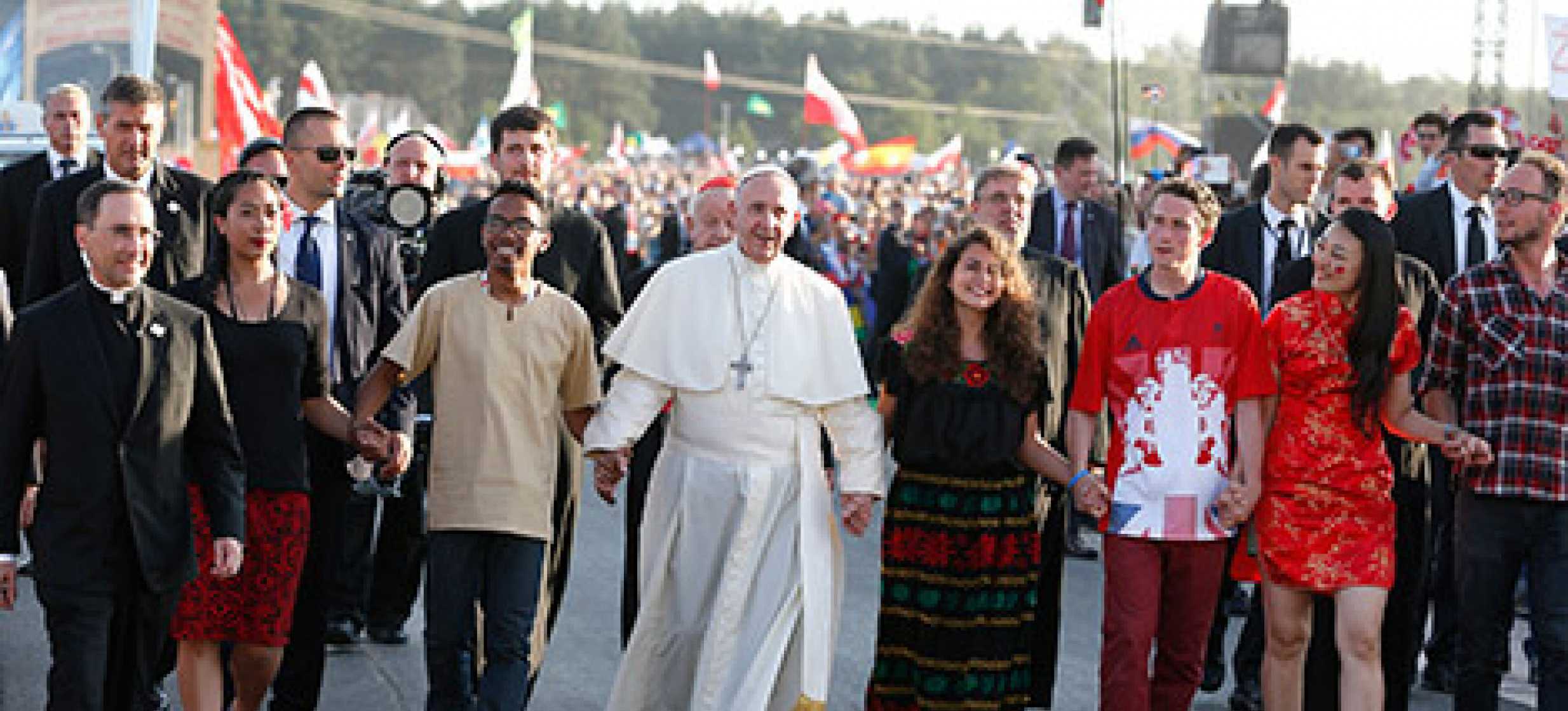 Pope Francis walks with World Youth Day pilgrims as he arrives for a July 30 prayer vigil at the Field of Mercy in Krakow, Poland. (CNS photo/Paul Haring)