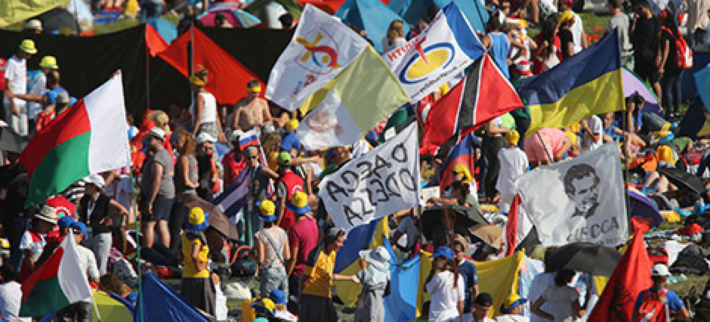 World Youth Day pilgrims wait for Pope Francis to arrive for a July 30 prayer vigil at the Field of Mercy in Krakow, Poland. (CNS photo/Bob Roller)