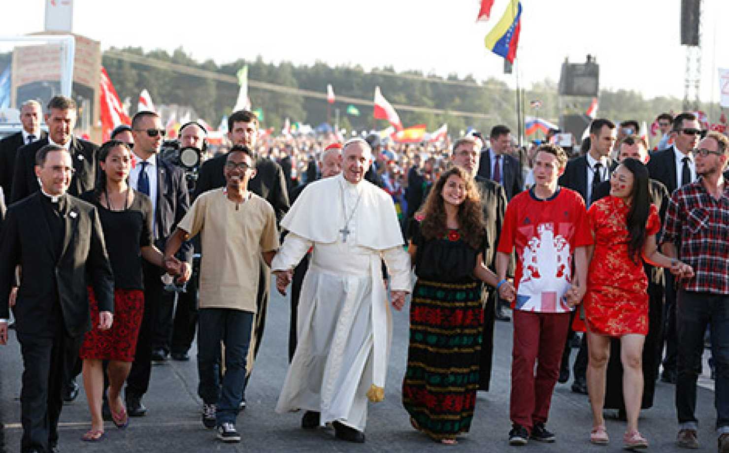 Pope Francis walks with World Youth Day pilgrims as he arrives for a July 30 prayer vigil at the Field of Mercy in Krakow, Poland. (CNS photo/Paul Haring)