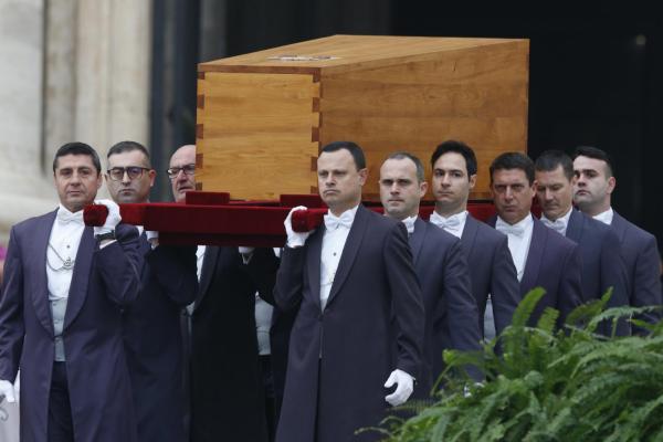 Pallbearers carry the casket of Pope Benedict XVI