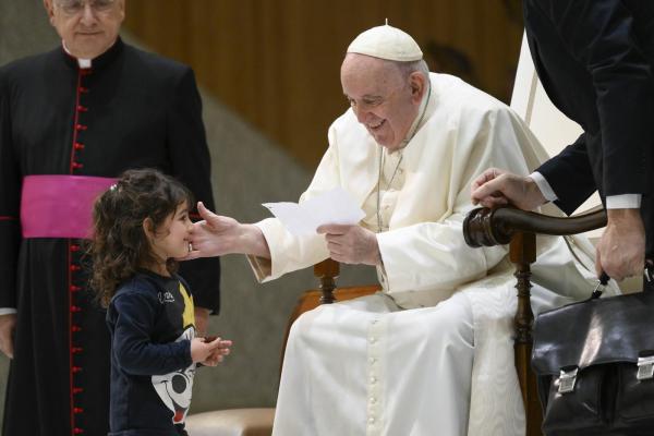 Pope Francis with a young girl
