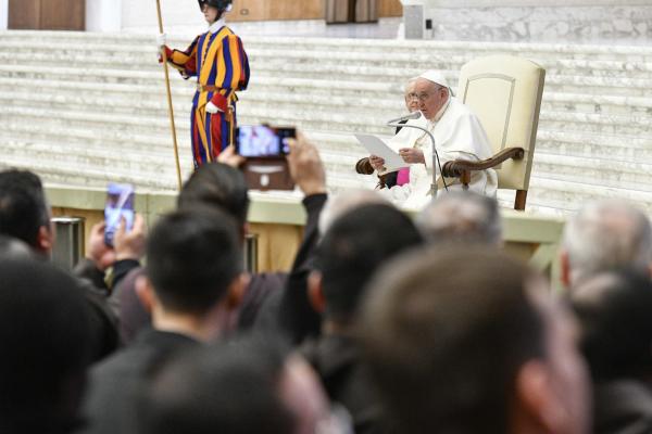 Pope Francis talks to priests
