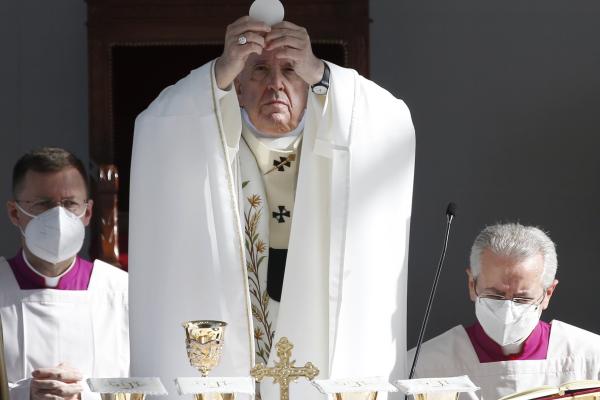 Pope Francis elevates the Eucharist. 