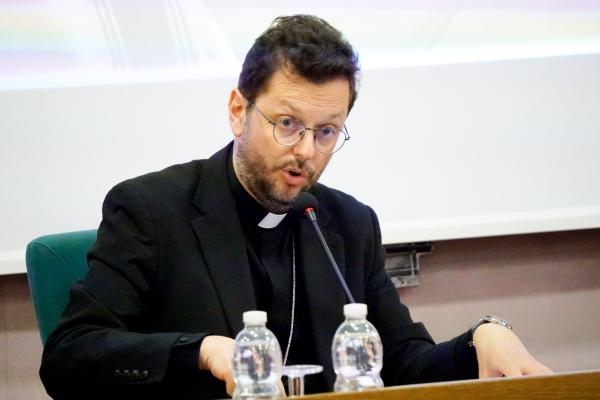 Cardinal Giorgio Marengo speaks at a conference.