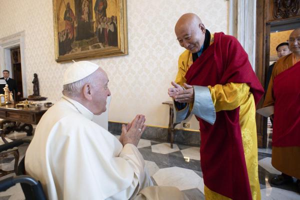 Pope Francis greets Buddhist leader