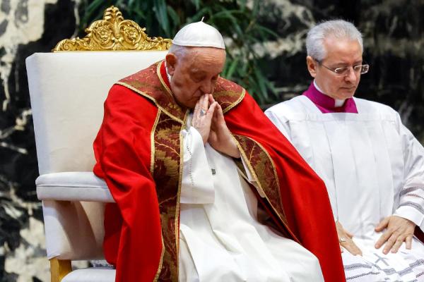 Pope Francis prays