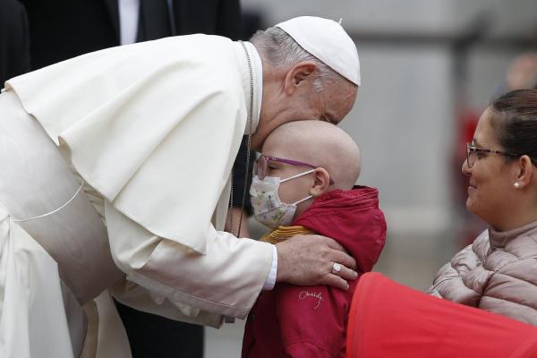 Pope Francis with sick child