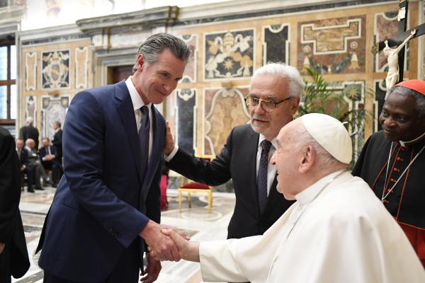 Pope Francis speaks with California Gov. Gavin Newsom.