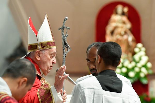 Pope Francis prays during Pentecost Mass.