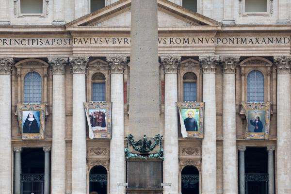 Banners of new saints hang on St. Peter's Basilica