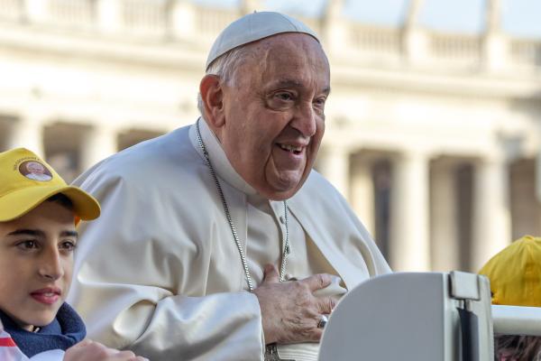 Pope Francis greets visitors in St. Peter's Square.