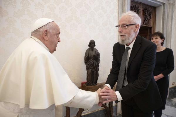 Pope Francis greets Cyril O'Regan.