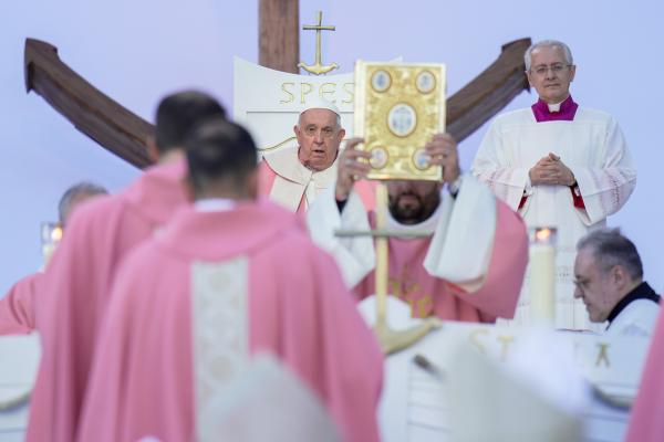 Concelebrants process before Pope Francis at the beginning of Mass.