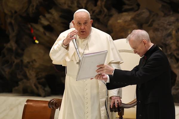 Pope Francis gives a blessing.