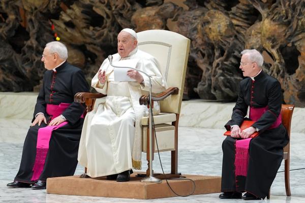Pope Francis shows the text of his speech that he didn't read