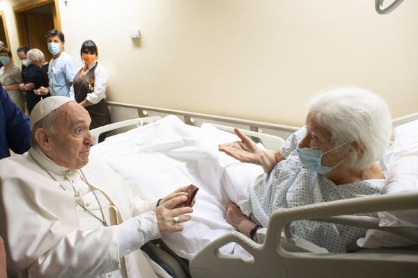 Pope Francis visits a patient in Rome