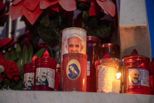 Votive candles outside the pope's hospital