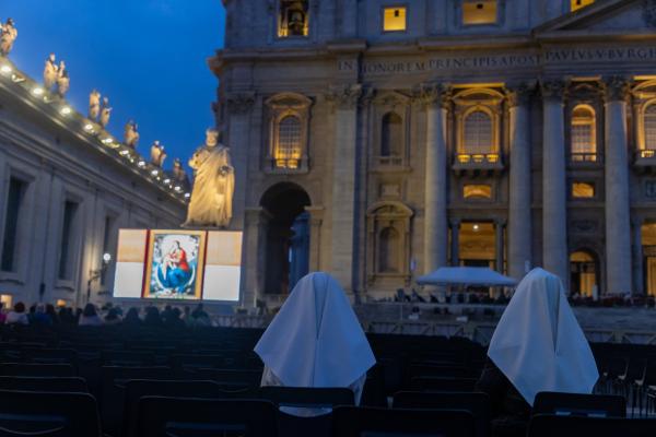Religious sisters pray the rosary for Pope Francis.