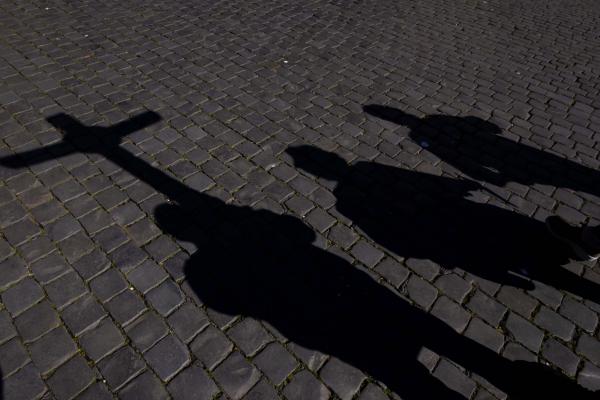 Shadows of pilgrims in St. Peter's Square