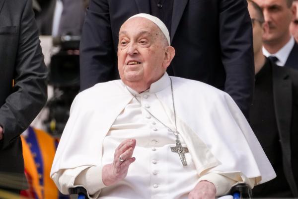 Pope Francis greets the faithful.