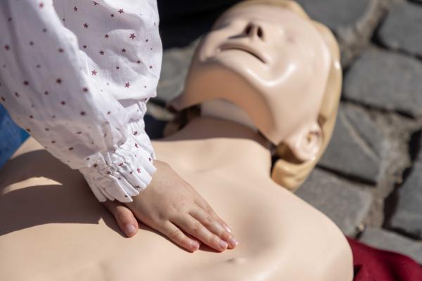A passerby practices emergency resuscitation in Rome's Piazza del Risorgimento.