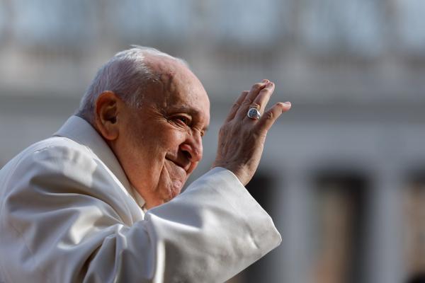 Pope Francis waves to the crowd
