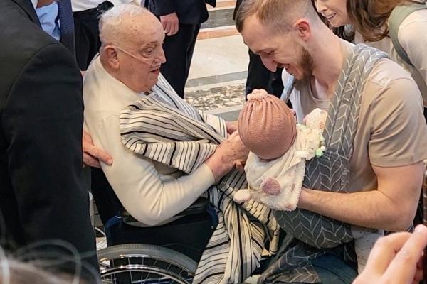 Pope Francis blesses a baby