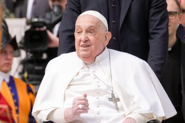 Pope Francis joins the faithful at the end of Palm Sunday Mass