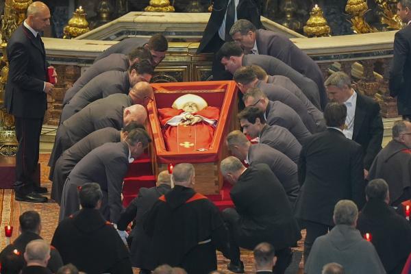 Pallbearers set down Pope Francis' casket in St. Peter's Basilica