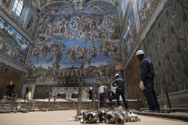 Workers prepare Sistine Chapel for the conclave