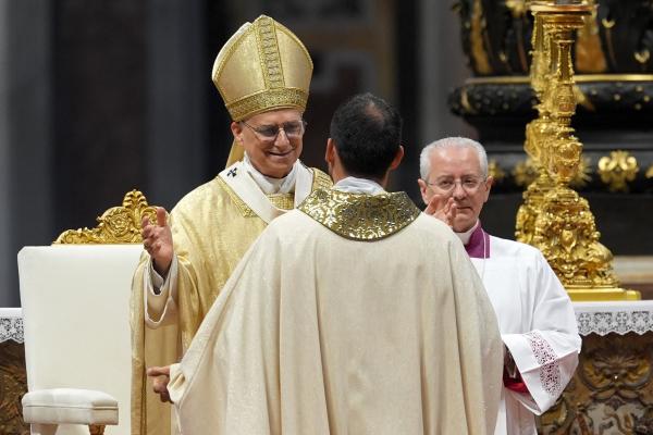 Pope Leo XIV embraces a new priest