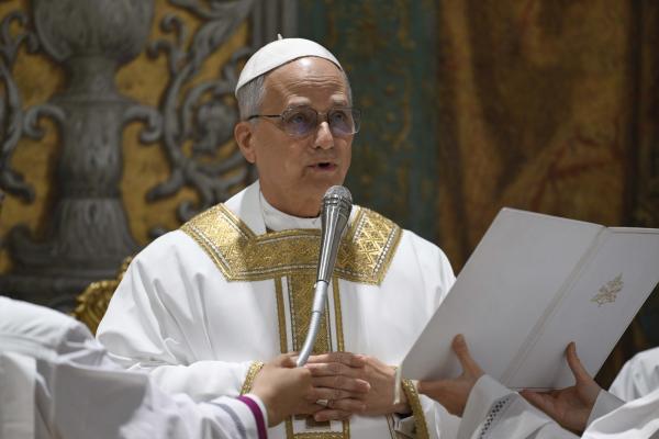 Pope Leo XIV offers a prayer during his first Mass as pope.
