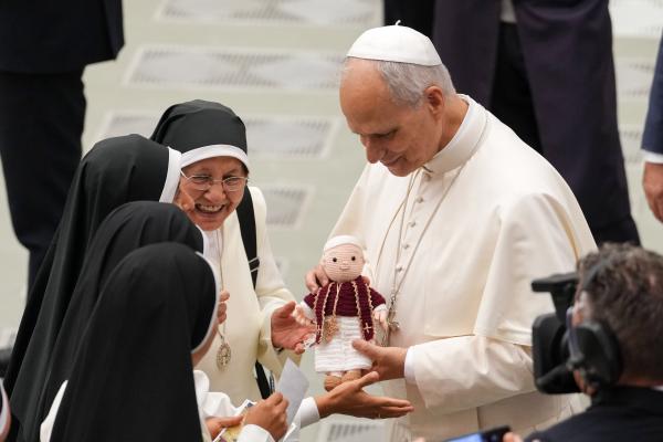 Pope Leo XIV accepts a crocheted doll of himself
