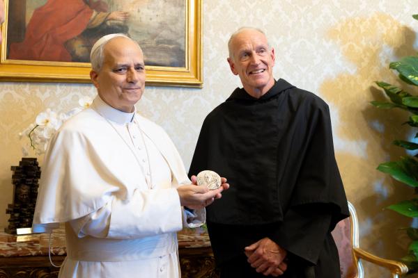 Pope Leo receives an award from Father Hagan