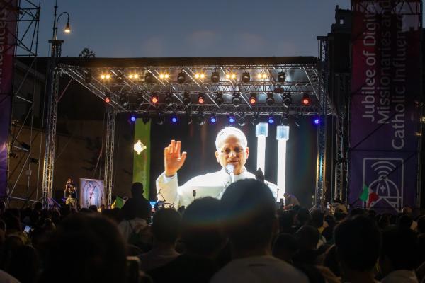 Pope Leo XIV is seen on a video screen