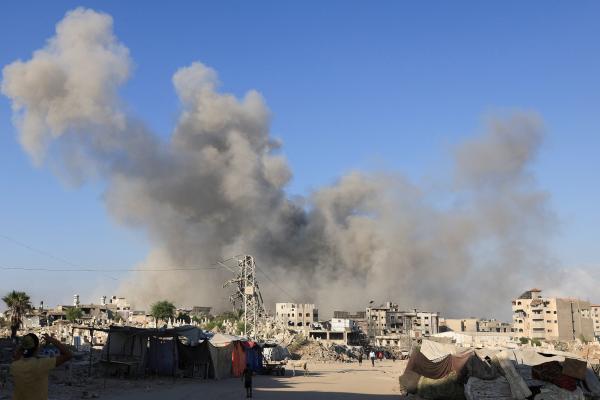 Smoke rises during an August military operation in Gaza City