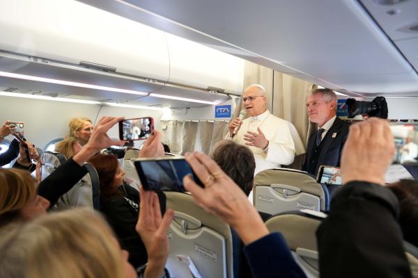 Pope Leo speaks to reporters on his flight to Turkey
